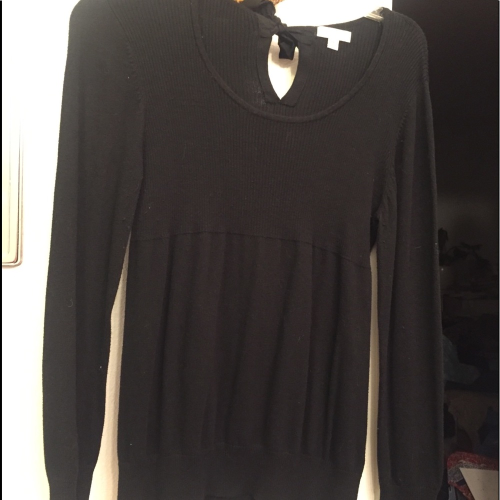 Scoop neck, tie back black rib knit sweater.